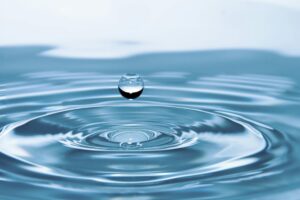 A mesmerizing shot of a water droplet capturing the beauty of liquid dynamics.